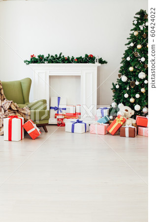 Christmas tree with gifts in the new year decor winter interior Christmas tree with gifts in the new year decor winter interior 60424022