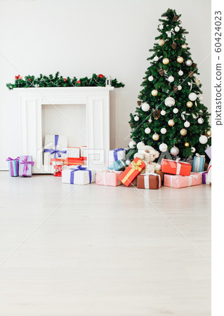 Christmas tree with gifts in the new year decor winter interior Christmas tree with gifts in the new year decor winter interior 60424023