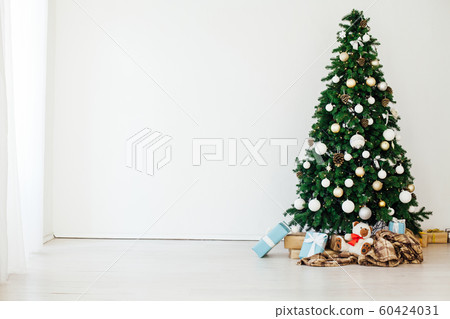 Christmas tree with gifts in the new year decor winter interior Christmas tree with gifts in the new year decor winter interior 60424031