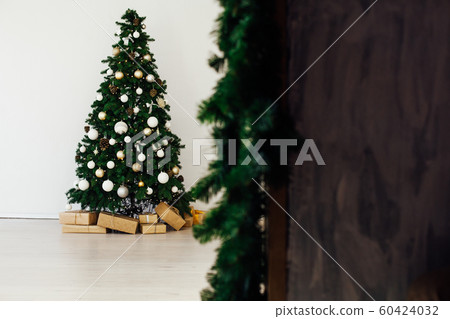 Christmas tree with gifts in the new year decor winter interior Christmas tree with gifts in the new year decor winter interior 60424032