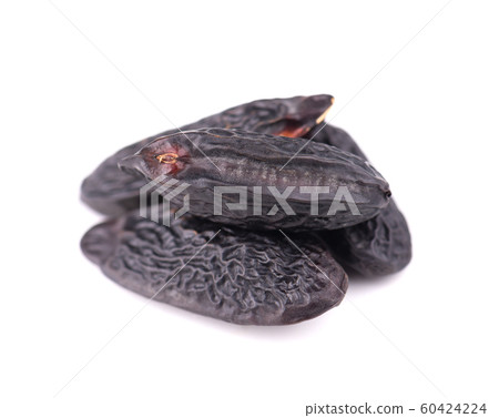 Tonka beans isolated on white background. Bean of Dipteryx odorata, cumaru or kumaru. Fresh aroma tonka beans. 60424224
