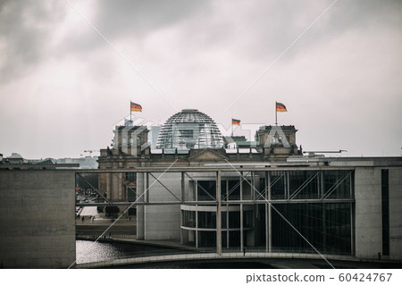 building of the German Bundestag from outside with cloudy sky 60424767