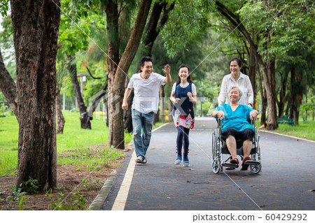 Happy family,asian little child girl or daughter playing tag game,running joyful with father,elderly in wheelchair,mother and senior grandmother having fun,laugh in outdoor park,parents enjoy touch ga Happy family,asian little child girl or daughter playing tag game,running joyful with father,elderly in wheelchair,mother and senior grandmother having fun,laugh in outdoor park,parents enjoy touch ga 60429292