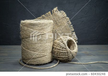 Jute twine, sackcloth fabric in close-up 60430248