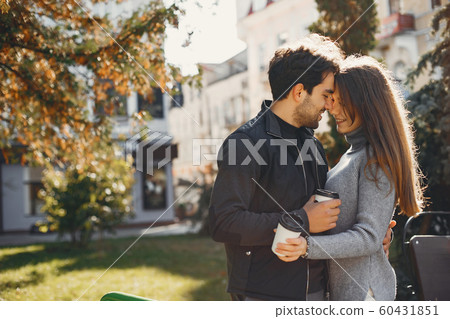Beautiful couple spend time in a summer city Beautiful couple spend time in a summer city 60431851