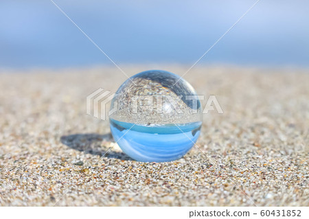 The sea and the sky that change to the sandy beach and crystal ball 60431852