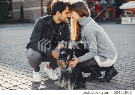 Beautiful couple spend time in a summer city 60431906