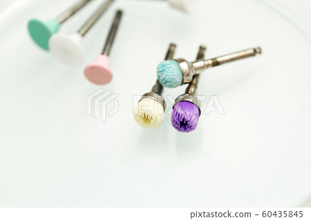 Dental polishing brush on a white isolated background close-up. Dental polishing brush on a white isolated background close-up. 60435845