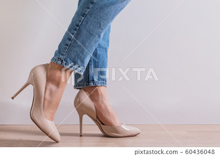 Woman's feet close-up wearing high heel shoes and 60436048
