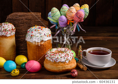 Easter cake and colorful eggs on a dark background Easter cake and colorful eggs on a dark background 60436131