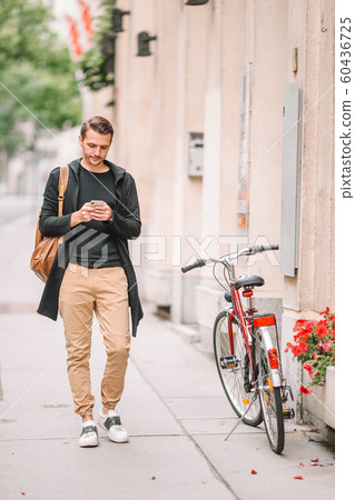 Young man background the old european city take selfie Young man background the old european city take selfie 60436725