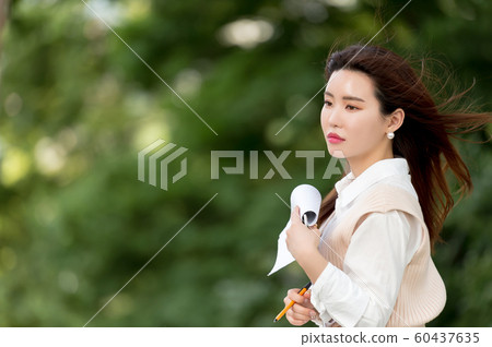 The look of a beautiful Korean woman, a park walk The look of a beautiful Korean woman, a park walk 60437635