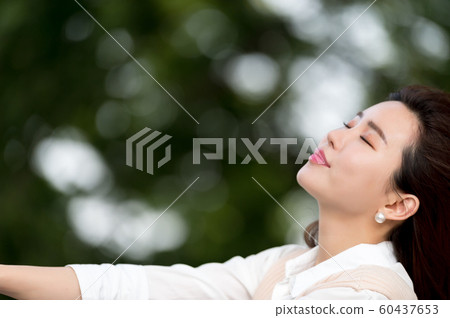 The look of a beautiful Korean woman, a park walk The look of a beautiful Korean woman, a park walk 60437653