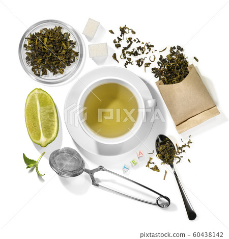 Green tea and accessories top view on white background 60438142