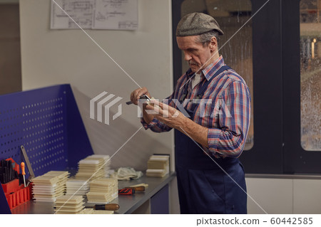 Senior worker at work Senior worker at work 60442585