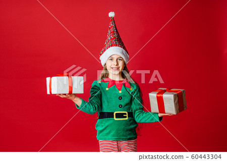 Merry Christmas, happy attractive girl with gifts Merry Christmas, happy attractive girl with gifts 60443304