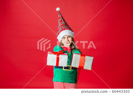 Merry Christmas, happy attractive girl with gifts Merry Christmas, happy attractive girl with gifts 60443305