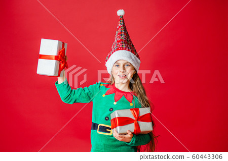 Merry Christmas, happy attractive girl with gifts Merry Christmas, happy attractive girl with gifts 60443306