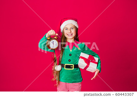 Merry Christmas, happy attractive girl with a Merry Christmas, happy attractive girl with a 60443307