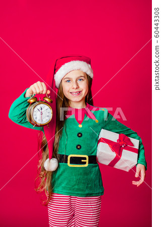 Merry Christmas, happy attractive girl with a Merry Christmas, happy attractive girl with a 60443308