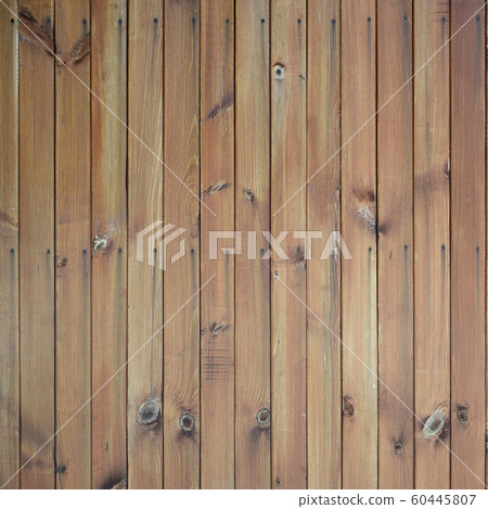 Close up of brown wooden fence panels. Many 60445807
