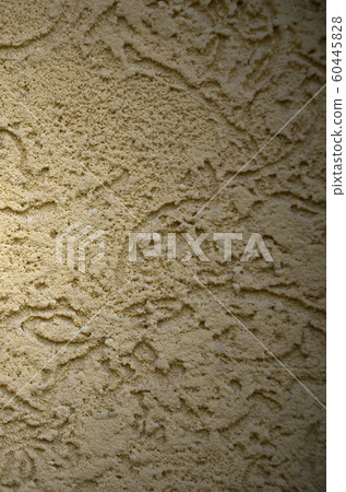 The texture of the beige decorative plaster in 60445828