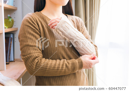 Woman wearing arm warmer Woman wearing arm warmer 60447077