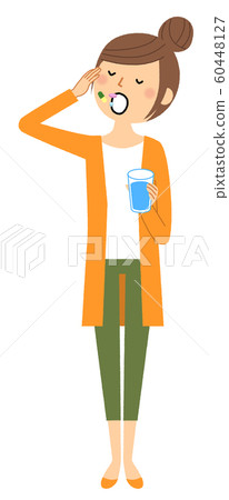 Young woman taking medicine 60448127