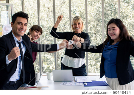 These business people holding jigsaw sincere 60448454