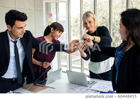 These business people holding jigsaw sincere 60448455