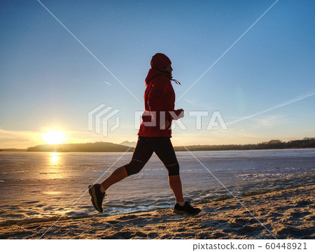 Runner woman feet running on offshore. Female Runner woman feet running on offshore. Female 60448921