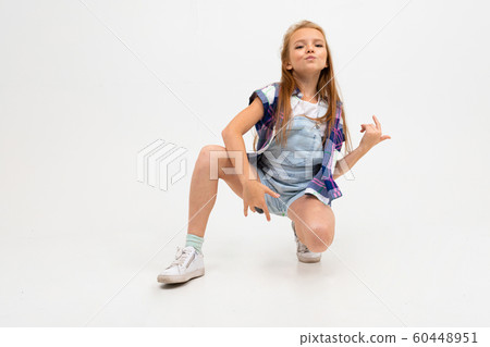 stylish girl improvises guitar with hands on a white background stylish girl improvises guitar with hands on a white background 60448951