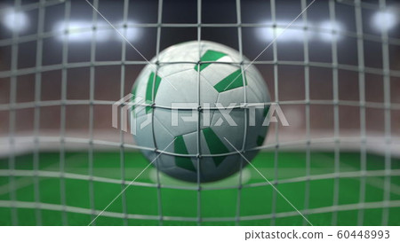 Football with flags of Nigeria in net against blurred stadium. Conceptual 3D rendering Football with flags of Nigeria in net against blurred stadium. Conceptual 3D rendering 60448993