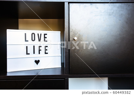 Sign, Love life on black wooden shelf, modern decoration in retro home clean interior 60449382