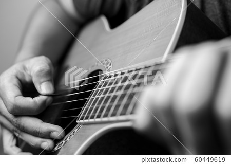 Musicians are playing acoustic guitar. Musicians are playing acoustic guitar. 60449619