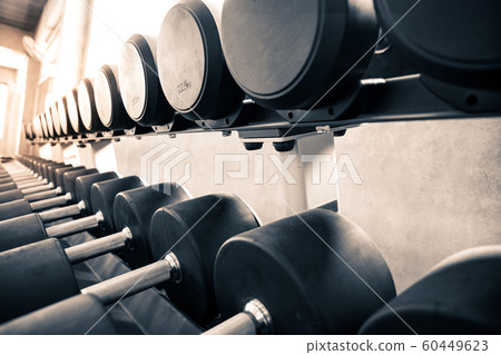 Within gym with modern fitness equipment. Within gym with modern fitness equipment. 60449623