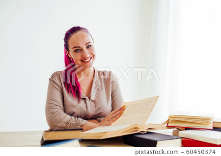 business girl sits in the Office for books folders of paper business girl sits in the Office for books folders of paper 60450374