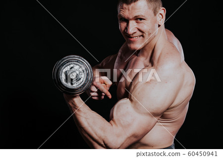Sport the athlete bodybuilder build muscles dumbbells 60450941