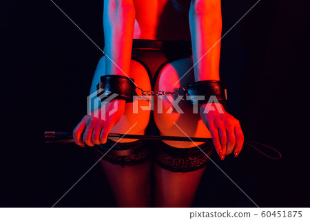 sexy ass submissive girl with hands in leather handcuffs and whip sexy ass submissive girl with hands in leather handcuffs and whip 60451875