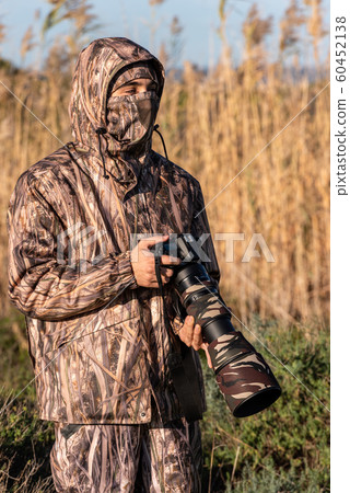 Nature photographer in action. Nature photographer in action. 60452138