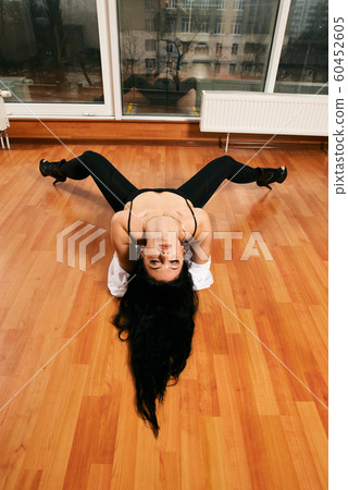 Attractive girl with a good figure dancing 60452605