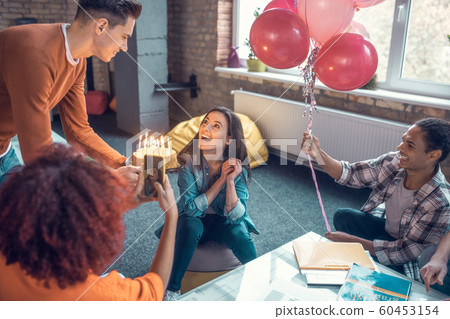 Handsome boyfriend congratulating his girlfriend with birthday 60453154