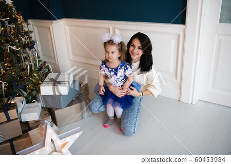 holidays, presents, christmas, x-mas, birthday concept - happy mother and child girl with gift box 60453984