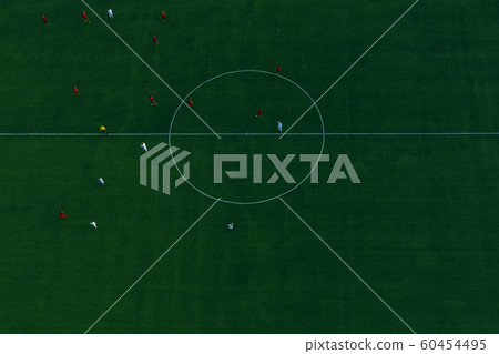 Green football stadium field. Aerial top view. Soccer players Green football stadium field. Aerial top view. Soccer players 60454495