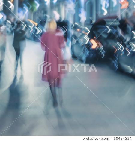 Abstract background of the city street in evening, silhouette of blond girl back back to us, blurred motion. Seasons, weather, modern lifestyle Abstract background of the city street in evening, silhouette of blond girl back back to us, blurred motion. Seasons, weather, modern lifestyle 60454534
