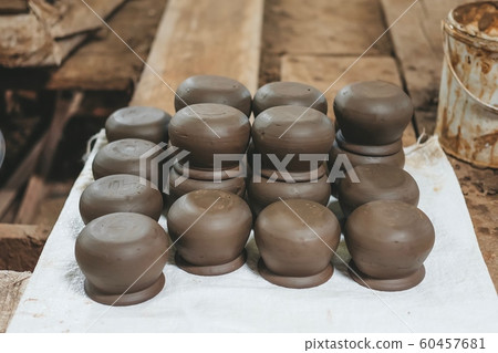 Row of Brown earthenware pot. Thailand art made by hand. 60457681
