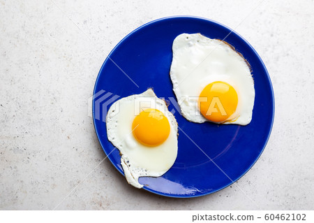 Fried eggs for breakfast 60462102