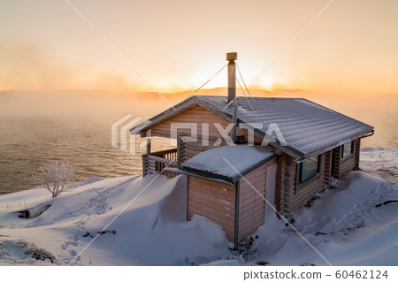 Wooden house on the beach in winter Wooden house on the beach in winter 60462124