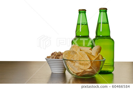 beer in bottles with chips and pistachios beer in bottles with chips and pistachios 60466584