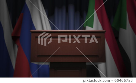 Many flags of Sudan and Russia behind speaker tribune, 3D rendering 60466783